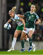 5 December 2023; Denise O'Sullivan of Republic of Ireland in action against Chloe McCarron of Northern Ireland during the UEFA Women's Nations League B match between Northern Ireland and Republic of Ireland at the National Football Stadium at Windsor Park in Belfast. Photo by Ramsey Cardy/Sportsfile