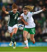 5 December 2023; Marissa Callaghan of Northern Ireland in action against Jamie Finn of Republic of Ireland during the UEFA Women's Nations League B match between Northern Ireland and Republic of Ireland at the National Football Stadium at Windsor Park in Belfast. Photo by Ramsey Cardy/Sportsfile Photo by Ramsey Cardy/Sportsfile