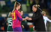 5 December 2023; Northern Ireland manager Tanya Oxtoby and Northern Ireland goalkeeper Maddison Harvey Clifford after the UEFA Women's Nations League B match between Northern Ireland and Republic of Ireland at the National Football Stadium at Windsor Park in Belfast. Photo by Ramsey Cardy/Sportsfile