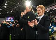 5 December 2023; Republic of Ireland interim head coach Eileen Gleeson and her coaching staff, from right, assistant coach Emma Byrne, assistant coach Colin Healy and goalkeeping coach Richie Fitzgibbon applaud after the playing of the National Anthem before the UEFA Women's Nations League B match between Northern Ireland and Republic of Ireland at the National Football Stadium at Windsor Park in Belfast. Photo by Stephen McCarthy/Sportsfile