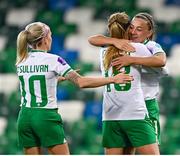 5 December 2023; Katie McCabe of Republic of Ireland celebrates with Denise O'Sullivan, left, and Kyra Carusa, 18, after their third goal, scored by Kyra Carusa, during the UEFA Women's Nations League B match between Northern Ireland and Republic of Ireland at the National Football Stadium at Windsor Park in Belfast. Photo by Stephen McCarthy/Sportsfile