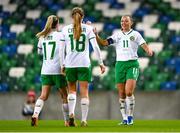 5 December 2023; Katie McCabe of Republic of Ireland celebrates with Jamie Finn, left, and Kyra Carusa, 18, after their third goal, scored by Kyra Carusa, during the UEFA Women's Nations League B match between Northern Ireland and Republic of Ireland at the National Football Stadium at Windsor Park in Belfast. Photo by Stephen McCarthy/Sportsfile