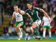 5 December 2023; Sarah McFadden of Northern Ireland in action against Denise O'Sullivan of Republic of Ireland during the UEFA Women's Nations League B match between Northern Ireland and Republic of Ireland at the National Football Stadium at Windsor Park in Belfast. Photo by Stephen McCarthy/Sportsfile