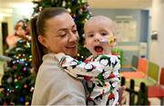 6 December 2023; Republic of Ireland's Katie McCabe with 14-month-old Zoe Mills during a visit to patients, families and staff at Children’s Health Ireland at Crumlin in Dublin. This Christmas, support can help give children & teenagers the very best chance in Children's Health Ireland at Crumlin, Temple Street, Tallaght & Connolly. Donations can be made at www.childrenshealth.ie . Photo by Stephen McCarthy/Sportsfile