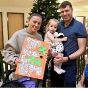 6 December 2023; Republic of Ireland's Katie McCabe with Ronan O'Sullivan and daughter Libby during a visit to patients, families and staff at Children’s Health Ireland at Crumlin in Dublin. This Christmas, support can help give children & teenagers the very best chance in Children's Health Ireland at Crumlin, Temple Street, Tallaght & Connolly. Donations can be made at www.childrenshealth.ie . Photo by Stephen McCarthy/Sportsfile