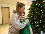 6 December 2023; Republic of Ireland's Katie McCabe with 11-year-old Emilyrose Gallagher, from Donegal, during a visit to patients, families and staff at Children’s Health Ireland at Crumlin in Dublin. This Christmas, support can help give children & teenagers the very best chance in Children's Health Ireland at Crumlin, Temple Street, Tallaght & Connolly. Donations can be made at www.childrenshealth.ie . Photo by Stephen McCarthy/Sportsfile
