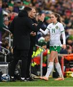 5 December 2023; Heather Payne of Republic of Ireland with interim assistant coach Colin Healy and interim goalkeeping coach Richie Fitzgibbon, left, after leaving the pitch during a second half substitution in the UEFA Women's Nations League B match between Northern Ireland and Republic of Ireland at the National Football Stadium at Windsor Park in Belfast. Photo by Stephen McCarthy/Sportsfile