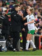 5 December 2023; Ruesha Littlejohn of Republic of Ireland with interim goalkeeping coach Richie Fitzgibbon after leaving the pitch during a second half substitution in the UEFA Women's Nations League B match between Northern Ireland and Republic of Ireland at the National Football Stadium at Windsor Park in Belfast. Photo by Stephen McCarthy/Sportsfile
