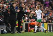 5 December 2023; Ruesha Littlejohn of Republic of Ireland with interim assistant coach Colin Healy and interim goalkeeping coach Richie Fitzgibbon, left, after leaving the pitch during a second half substitution in the UEFA Women's Nations League B match between Northern Ireland and Republic of Ireland at the National Football Stadium at Windsor Park in Belfast. Photo by Stephen McCarthy/Sportsfile