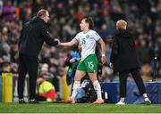 5 December 2023; Lucy Quinn of Republic of Ireland with interim assistant coach Colin Healy as she leaves the pitch during a second half substitution in the UEFA Women's Nations League B match between Northern Ireland and Republic of Ireland at the National Football Stadium at Windsor Park in Belfast. Photo by Stephen McCarthy/Sportsfile