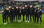 5 December 2023; Republic of Ireland staff, from left, performance coach Ivi Casagrande, performance psychologist Sarah Murray, Dr Siobhan Forman, team doctor, physiotherapist Angela Kenneally, masseuse Hannah Tobin Jones, physiotherapist Susie Coffey, performance analyst Andy Holt, interim goalkeeping coach Richie Fitzgibbon, Derek McDonnell, operations; and video creator Cara Gaynor after the UEFA Women's Nations League B match between Northern Ireland and Republic of Ireland at the National Football Stadium at Windsor Park in Belfast. Photo by Stephen McCarthy/Sportsfile