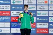 7 December 2023; Daniel Wiffen of Ireland receives his gold medal after winning the men's 1500m freestyle during day three of the European Short Course Swimming Championships 2023 at the Aquatics Complex in Otopeni, Romania. Photo by Nikola Krstic/Sportsfile
