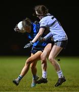 7 December 2023; Aisling Walls of UCD in action against Lauren Garland of UL during the 3rd Level Ladies Football League Division 2 final match between UCD and Ulster University at Dundalk Institute of Technology in Dundalk, Louth. Photo by Ben McShane/Sportsfile