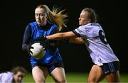 7 December 2023; Jodi Egan of UCD in action against Maeve Ferguson of UL during the 3rd Level Ladies Football League Division 2 final match between UCD and Ulster University at Dundalk Institute of Technology in Dundalk, Louth. Photo by Ben McShane/Sportsfile