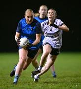 7 December 2023; Amy O'Leary of UCD in action against Neve Landon of UL during the 3rd Level Ladies Football League Division 2 final match between UCD and Ulster University at Dundalk Institute of Technology in Dundalk, Louth. Photo by Ben McShane/Sportsfile