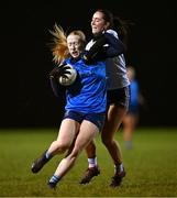 7 December 2023; Jodi Egan of UCD is tackled by Holly McQuaid of UL during the 3rd Level Ladies Football League Division 2 final match between UCD and Ulster University at Dundalk Institute of Technology in Dundalk, Louth. Photo by Ben McShane/Sportsfile