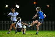 7 December 2023; Jodie McQuillan of UCD has a kick blocked by Lauren Garland of UL during the 3rd Level Ladies Football League Division 2 final match between UCD and Ulster University at Dundalk Institute of Technology in Dundalk, Louth. Photo by Ben McShane/Sportsfile