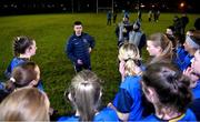 7 December 2023; UL joint-manager Eoin Donnelly congratulates the UCD players after the 3rd Level Ladies Football League Division 2 final match between UCD and Ulster University at Dundalk Institute of Technology in Dundalk, Louth. Photo by Ben McShane/Sportsfile