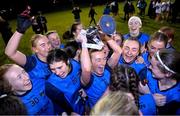 7 December 2023; UCD captain Ciara Lawlor celebrates with the cup alongside her teammates after the 3rd Level Ladies Football League Division 2 final match between UCD and Ulster University at Dundalk Institute of Technology in Dundalk, Louth. Photo by Ben McShane/Sportsfile