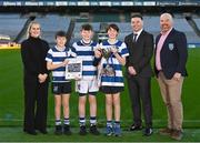 9 December 2023; Pictured is Allianz sponsorship executive Katie Bradley, James Hayden of Cumann na mBunscol, Religious and Education CRE Sean Doolin with pupils from Willow Park NS at the 2023 Allianz Cumann Na mBunscol Annual Football Awards at Croke Park in Dublin. Photo by Eóin Noonan/Sportsfile