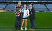 9 December 2023; Pictured is Caoimhe Cullen Murphy from St Laurence's National School with her father Vinny, left, and Jerry Grogan of Cumann na mBunscol at the 2023 Allianz Cumann Na mBunscol Annual Football Awards at Croke Park in Dublin. Photo by Eóin Noonan/Sportsfile