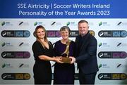 8 December 2023; Bernie Duggan accepts the Women’s Personality of the Year award, on behalf of her daughter Karen Duggan of Peamount United, from Ashley Morrow, head of brand, advertising and sponsorship at SSE Airtricity; left, in the company of Peamount United manager James O'Callaghan during the SSE Airtricity / Soccer Writers Ireland Awards 2023 at the Dublin Royal Convention Centre in Dublin. Photo by Stephen McCarthy/Sportsfile