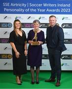 8 December 2023; Bernie Duggan accepts the Women’s Personality of the Year award, on behalf of her daughter Karen Duggan of Peamount United, from Ashley Morrow, head of brand, advertising and sponsorship at SSE Airtricity; left, in the company of Peamount United manager James O'Callaghan during the SSE Airtricity / Soccer Writers Ireland Awards 2023 at the Dublin Royal Convention Centre in Dublin. Photo by Stephen McCarthy/Sportsfile