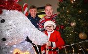 8 December 2023; Senan Lynch, from Dublin, with TV presenter Peter Finn and Dublin footballer Cian Murphy during the turning on of the official Christmas Lights at Children’s Health Ireland at Connolly in Blanchardstown, Dublin. This Christmas, support can help give children & teenagers the very best chance in Children's Health Ireland at Crumlin, Temple Street, Tallaght & Connolly. Donations can be made at www.childrenshealth.ie. Photo by Harry Murphy/Sportsfile  *** Local Caption *** NOPRINTSALES