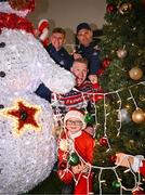 8 December 2023; Senan Lynch, from Dublin, with TV presenter Peter Finn and Dublin footballer Cian Murphy and manager Dessie Farrell during the turning on of the official Christmas Lights at Children’s Health Ireland at Connolly in Blanchardstown, Dublin. This Christmas, support can help give children & teenagers the very best chance in Children's Health Ireland at Crumlin, Temple Street, Tallaght & Connolly. Donations can be made at www.childrenshealth.ie. Photo by Harry Murphy/Sportsfile  *** Local Caption *** NOPRINTSALES