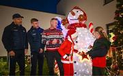 8 December 2023; Senan Lynch and Faye Smith-Browne, both from Dublin, turn on the lights alongside Dublin football manager Dessie Farrell, Dublin footballer Cian Murphy and TV presenter Peter Finn during the turning on of the official Christmas Lights at Children’s Health Ireland at Connolly in Blanchardstown, Dublin. This Christmas, support can help give children & teenagers the very best chance in Children's Health Ireland at Crumlin, Temple Street, Tallaght & Connolly. Donations can be made at www.childrenshealth.ie. Photo by Harry Murphy/Sportsfile  *** Local Caption *** NOPRINTSALES