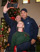 8 December 2023; Dublin football manager Dessie Farrell takes a selfie with Faye Smith-Browne and her father Declan Browne during the turning on of the official Christmas Lights at Children’s Health Ireland at Connolly in Blanchardstown, Dublin. This Christmas, support can help give children & teenagers the very best chance in Children's Health Ireland at Crumlin, Temple Street, Tallaght & Connolly. Donations can be made at www.childrenshealth.ie. Photo by Harry Murphy/Sportsfile  *** Local Caption *** NOPRINTSALES