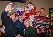 8 December 2023; Dublin footballer Cian Murphy and Santa Claus take a selfie with Faye Smith-Browne and her father Declan Browne during the turning on of the official Christmas Lights at Children’s Health Ireland at Connolly in Blanchardstown, Dublin. This Christmas, support can help give children & teenagers the very best chance in Children's Health Ireland at Crumlin, Temple Street, Tallaght & Connolly. Donations can be made at www.childrenshealth.ie. Photo by Harry Murphy/Sportsfile  *** Local Caption *** NOPRINTSALES