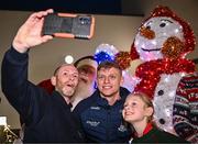 8 December 2023; Dublin footballer Cian Murphy and Santa Claus take a selfie with Faye Smith-Browne and her father Declan Browne during the turning on of the official Christmas Lights at Children’s Health Ireland at Connolly in Blanchardstown, Dublin. This Christmas, support can help give children & teenagers the very best chance in Children's Health Ireland at Crumlin, Temple Street, Tallaght & Connolly. Donations can be made at www.childrenshealth.ie. Photo by Harry Murphy/Sportsfile  *** Local Caption *** NOPRINTSALES