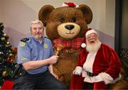 8 December 2023; Member of An Garda Síochána Chris O'Connor with Santa Claus during the turning on of the official Christmas Lights at Children’s Health Ireland at Connolly in Blanchardstown, Dublin. This Christmas support can help give children and teenagers the very best chance in Children's Health Ireland at Crumlin, Temple Street, Tallaght & Connolly. Donations can be made at www.childrenshealth.ie. Photo by Harry Murphy/Sportsfile  *** Local Caption *** NOPRINTSALES