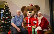 8 December 2023; Member of An Garda Síochána Chris O'Connor and Santa Claus with Senan Lynch, from Dublin, and Elise Fegan, from Dublin, during the turning on of the official Christmas Lights at Children’s Health Ireland at Connolly in Blanchardstown, Dublin. This Christmas support can help give children and teenagers the very best chance in Children's Health Ireland at Crumlin, Temple Street, Tallaght & Connolly. Donations can be made at www.childrenshealth.ie. Photo by Harry Murphy/Sportsfile  *** Local Caption *** NOPRINTSALES