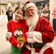 8 December 2023; Elise Fegan, from Dublin, with Santa Claus during the turning on of the official Christmas Lights at Children’s Health Ireland at Connolly in Blanchardstown, Dublin. This Christmas, support can help give children & teenagers the very best chance in Children's Health Ireland at Crumlin, Temple Street, Tallaght & Connolly. Donations can be made at www.childrenshealth.ie. Photo by Harry Murphy/Sportsfile  *** Local Caption *** NOPRINTSALES