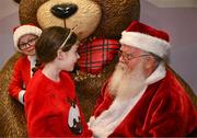 8 December 2023; Elise Fegan, from Dublin, with Santa Claus during the turning on of the official Christmas Lights at Children’s Health Ireland at Connolly in Blanchardstown, Dublin. This Christmas, support can help give children & teenagers the very best chance in Children's Health Ireland at Crumlin, Temple Street, Tallaght & Connolly. Donations can be made at www.childrenshealth.ie. Photo by Harry Murphy/Sportsfile  *** Local Caption *** NOPRINTSALES