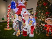 8 December 2023; Callum and Freya Doran, from Dublin, with Santa Claus during the turning on of the official Christmas Lights at Children’s Health Ireland at Connolly in Blanchardstown, Dublin. This Christmas, support can help give children & teenagers the very best chance in Children's Health Ireland at Crumlin, Temple Street, Tallaght & Connolly. Donations can be made at www.childrenshealth.ie. Photo by Harry Murphy/Sportsfile  *** Local Caption *** NOPRINTSALES