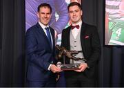 8 December 2023; Derry City goalkeeper Brian Maher is presented with the Goalkeeper of the Year award by Páraic Casey, son of the late Des Casey, during the SSE Airtricity / Soccer Writers Ireland Awards 2023 at the Dublin Royal Convention Centre in Dublin. Photo by Stephen McCarthy/Sportsfile