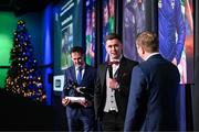 8 December 2023; Derry City goalkeeper Brian Maher is interviewed by MC Darragh Maloney as Páraic Casey, son of the late Des Casey, holds his Goalkeeper of the Year award  during the SSE Airtricity / Soccer Writers Ireland Awards 2023 at the Dublin Royal Convention Centre in Dublin. Photo by Stephen McCarthy/Sportsfile