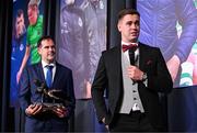 8 December 2023; Derry City goalkeeper Brian Maher is interviewed as Páraic Casey, son of the late Des Casey, holds his Goalkeeper of the Year award  during the SSE Airtricity / Soccer Writers Ireland Awards 2023 at the Dublin Royal Convention Centre in Dublin. Photo by Stephen McCarthy/Sportsfile