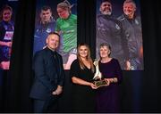 8 December 2023; Bernie Duggan, in the company of Peamount United manager James O'Callaghan, accepts the Women’s Personality of the Year award, on behalf of her daughter Karen Duggan of Peamount United, from Ashley Morrow, head of brand, advertising and sponsorship at SSE Airtricity; during the SSE Airtricity / Soccer Writers Ireland Awards 2023 at the Dublin Royal Convention Centre in Dublin. Photo by Stephen McCarthy/Sportsfile
