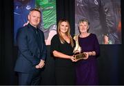 8 December 2023; Bernie Duggan, in the company of Peamount United manager James O'Callaghan, accepts the Women’s Personality of the Year award, on behalf of her daughter Karen Duggan of Peamount United, from Ashley Morrow, head of brand, advertising and sponsorship at SSE Airtricity; during the SSE Airtricity / Soccer Writers Ireland Awards 2023 at the Dublin Royal Convention Centre in Dublin. Photo by Stephen McCarthy/Sportsfile