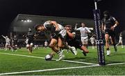 8 December 2023; Pablo Uberti of Bordeaux-Begles scores his side's sixth try, despite the tackle of Connacht's John Porch, during the Investec Champions Cup Pool 1 Round 1 match between Connacht and Bordeaux-Begles at The Sportsground in Galway. Photo by Seb Daly/Sportsfile