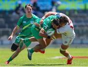 9 December 2023; Mark Roche of Ireland is tackled by Orrin Bizer of USA during the Men's Pool A match between Ireland and USA during the HSBC SVNS Rugby Tournament at DHL Stadium in Cape Town, South Africa. Photo by Shaun Roy/Sportsfile