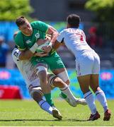 9 December 2023; Zac Ward of Ireland is tackled by Ben Pinkelman Naima Fuala'au of USA during the Men's Pool A match between Ireland and USA during the HSBC SVNS Rugby Tournament at DHL Stadium in Cape Town, South Africa. Photo by Shaun Roy/Sportsfile