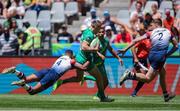 9 December 2023; Terry Kennedy of Ireland is tackled by Kaleem Barreto of Great Britain during the Men's Pool A match between Ireland and Great Britain during the HSBC SVNS Rugby Tournament at DHL Stadium in Cape Town, South Africa. Photo by Shaun Roy/Sportsfile