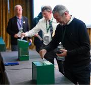 9 December 2023; David Moran of the Leinster Football Association casts a vote during an extraordinary general meeting in advance of the Football Association of Ireland's annual general meeting at the Radisson Blu St. Helen's Hotel in Dublin. Photo by Stephen McCarthy/Sportsfile