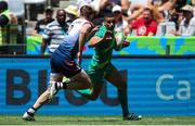 9 December 2023; Jordan Conroy of Ireland in action againstTom Williams of Great Britain during the Men's Pool A match between Ireland and Great Britain during the HSBC SVNS Rugby Tournament at DHL Stadium in Cape Town, South Africa. Photo by Shaun Roy/Sportsfile