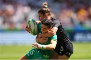 9 December 2023; Amee-Leigh Murphy Crowe of Ireland is tackled by Michaela Blyde of New Zealand during the Women's Pool B match between New Zealand and Ireland during the HSBC SVNS Rugby Tournament at DHL Stadium in Cape Town, South Africa. Photo by Shaun Roy/Sportsfile